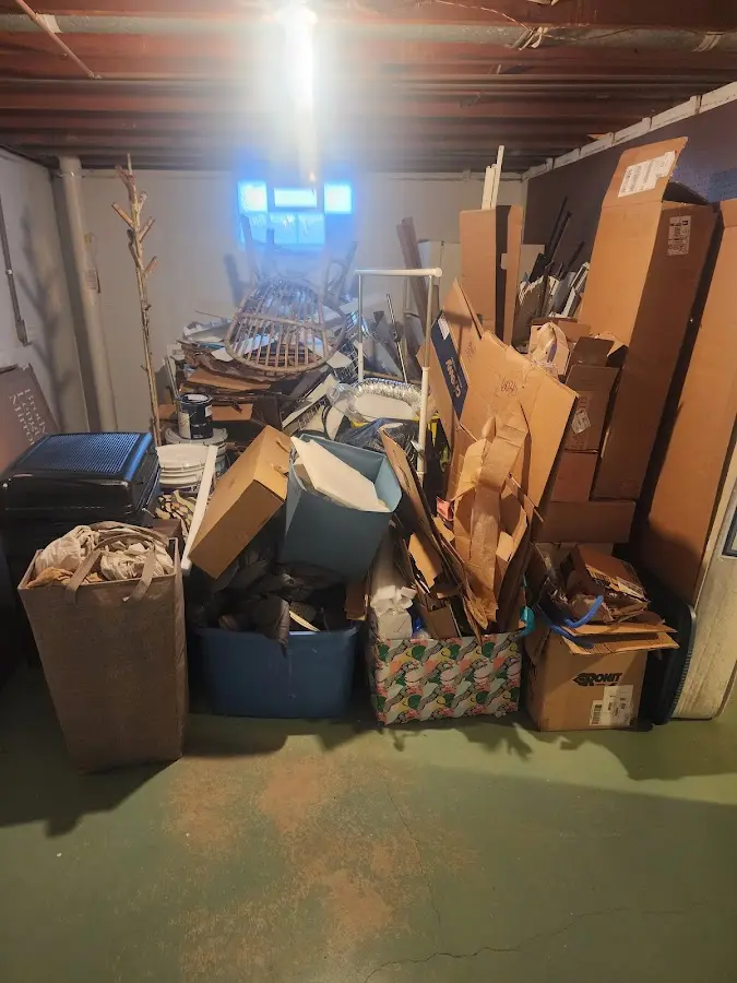 Roll-off dumpster container at job site for 2 Yard Dumpster Rental in Ada